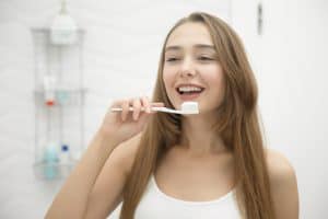 female-brushing-teeth